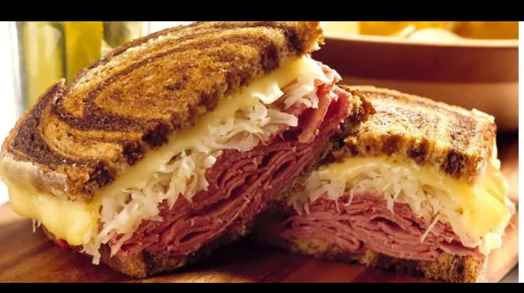 Annie's Cafe Reuben sandwich served hot with a side of crispy fries in Waynesville, NC.